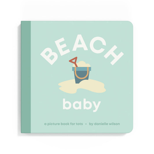 Book titled 'Beach Baby' with a sand bucket and shovel illustration on a light blue background